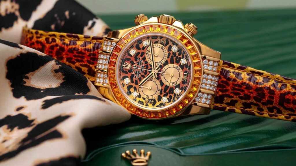 Rolex Daytona leopard super clone watch with orange moissanite diamond bezel and leopard print leather strap